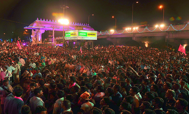 A massive crowd gathers at Tank Bund in the city on Sunday night to celebrate the birth of Telangana state. Slogans and the thunder of fireworks reverberated into the night as people joined in the celebrations to mark the historical day. (Photo: DC/